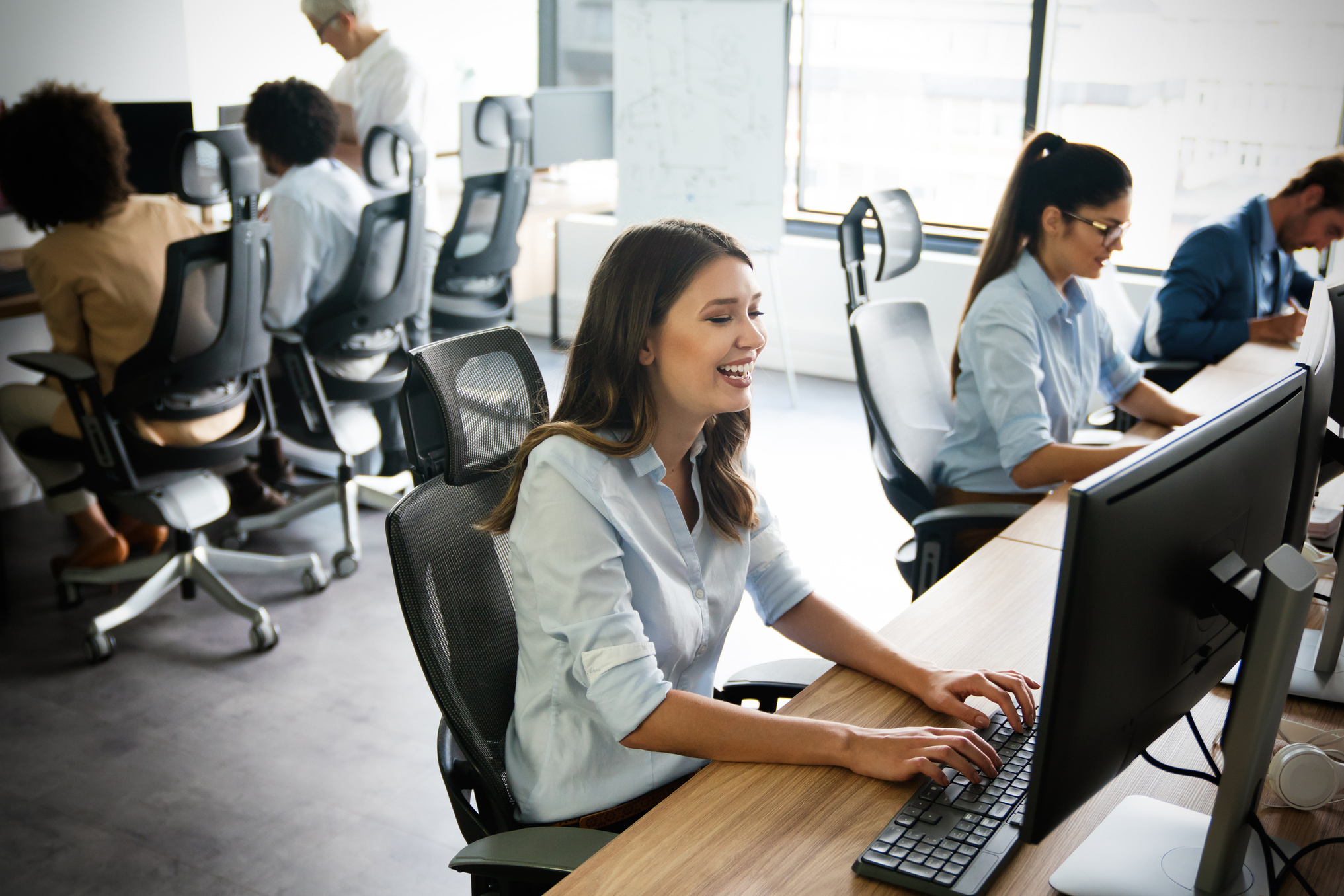 Creative people working in office on computer